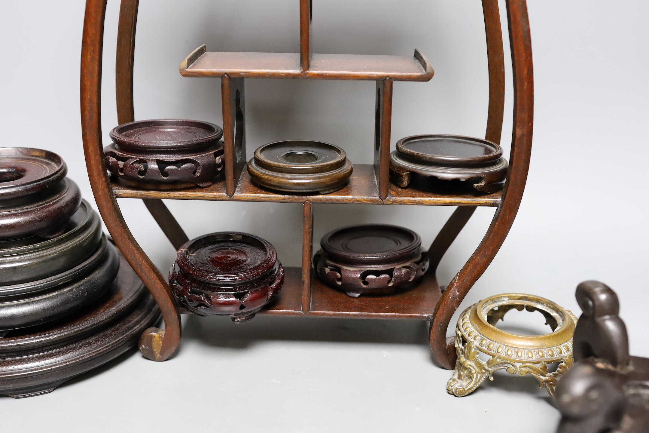 A Chinese wood shelf and various wood stands, tallest 45cm